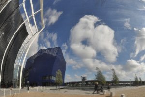 Reflected skyscape with buildings and birder