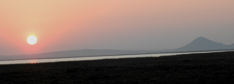 Sunset with wetland/Hill